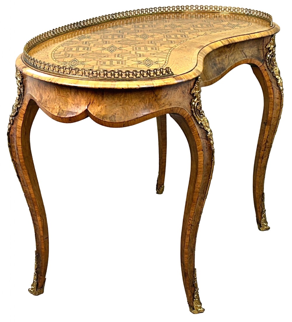 A 19th-century kidney-shaped burr walnut table featuring marquetry inlay, cabriole legs, and brass ormolu mounts with a pierced gallery edge. View IV
