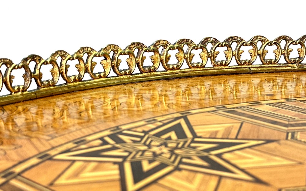 A 19th-century kidney-shaped burr walnut table featuring marquetry inlay, cabriole legs, and brass ormolu mounts with a pierced gallery edge. View XIII