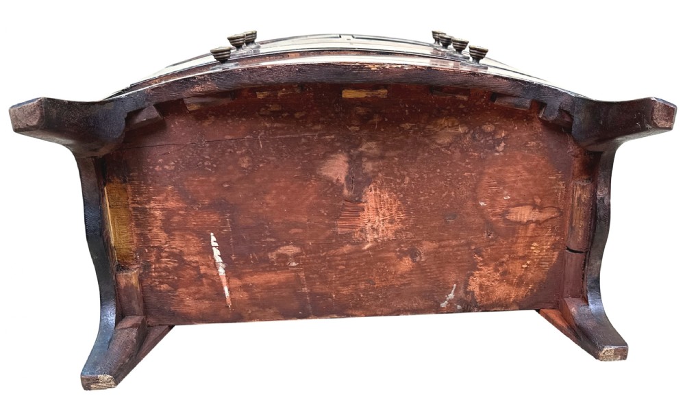 A Georgian mahogany miniature bowfront chest of drawers with flame mahogany drawer fronts, turned brass handles, and splayed bracket feet. View VIII