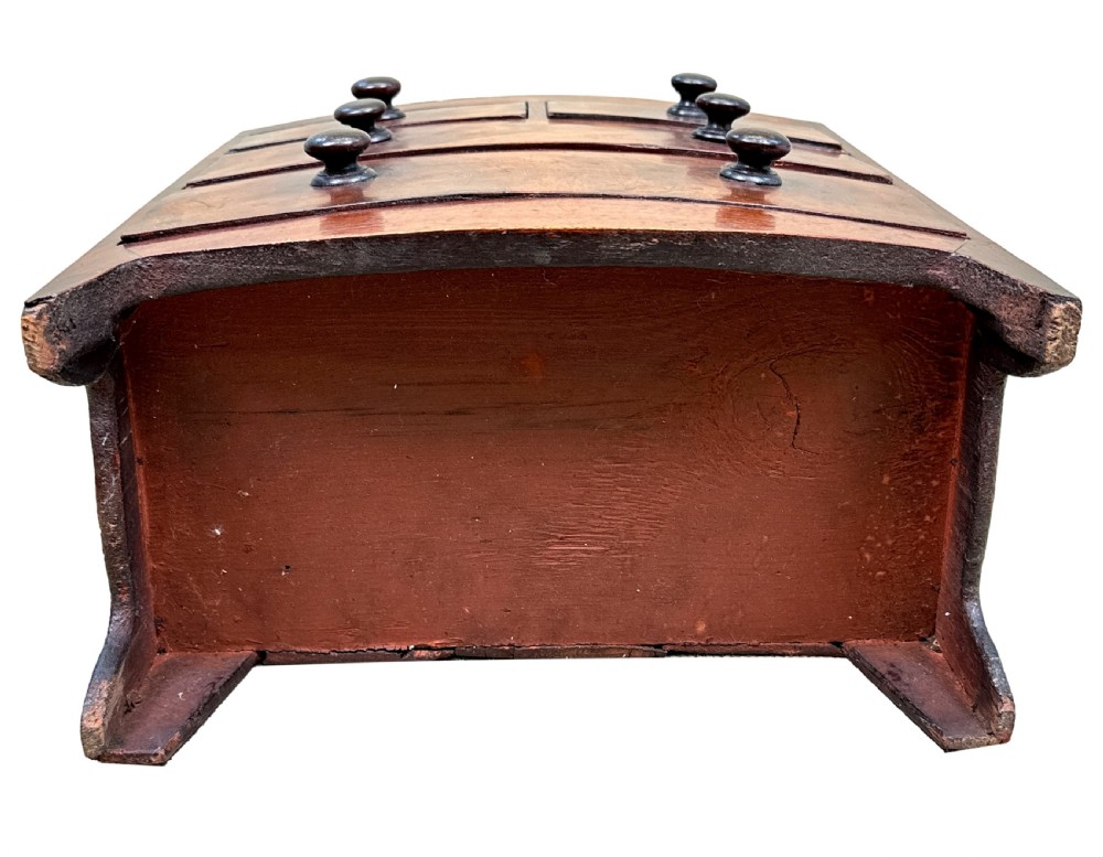 A Victorian miniature mahogany bowfront chest featuring two short over two long drawers with turned wooden knobs and bracket feet. View IX
