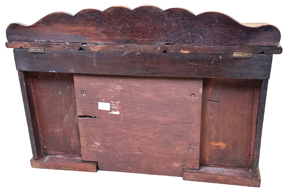 A miniature Regency mahogany tea caddy crafted in the form of a pedestal sideboard with a fan-carved cresting backrail. View IX