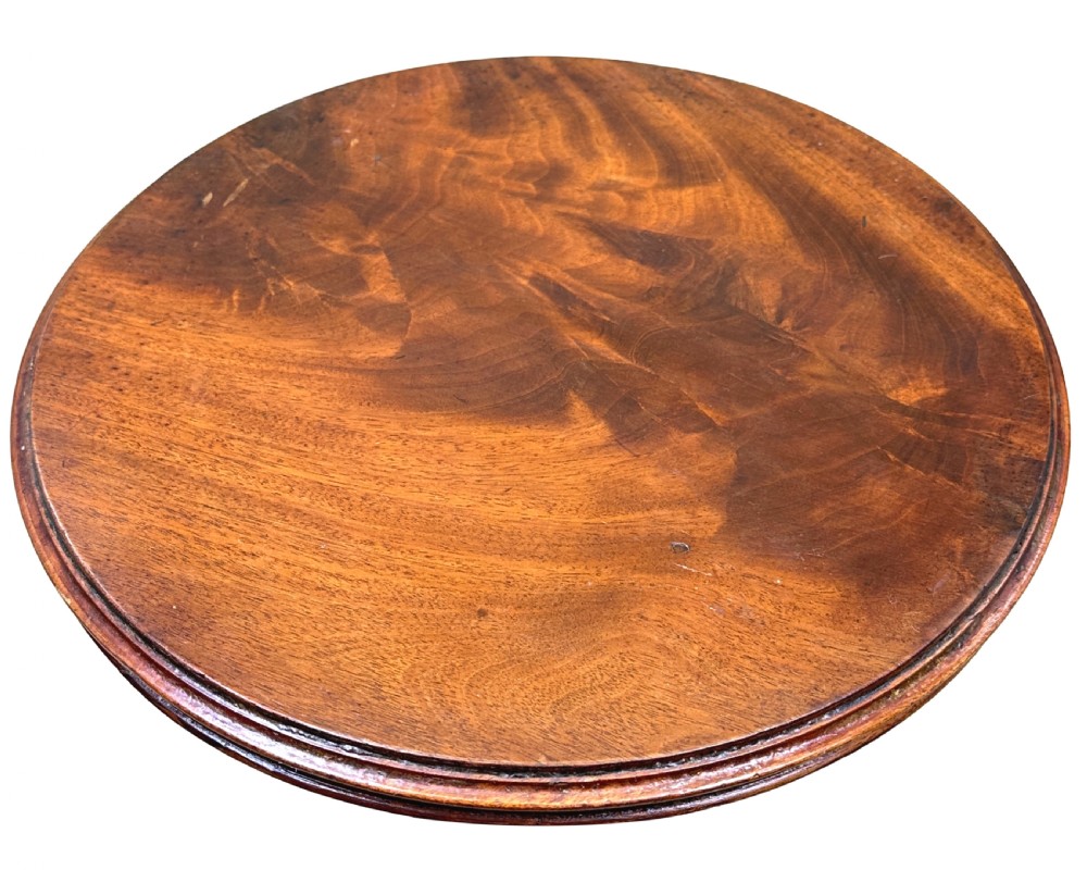 A mid-19th-century miniature circular mahogany centre table featuring a turned central column and a triform base with carved feet. View III