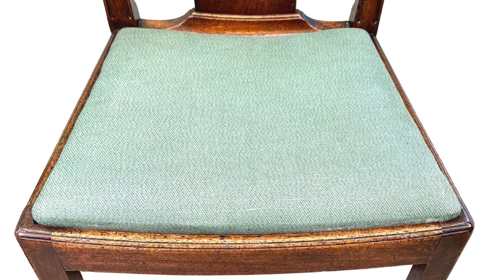 A pair of 18th-century Georgian mahogany side chairs featuring pierced back splats, serpentine top rails, and light green upholstered drop-in seats. View III