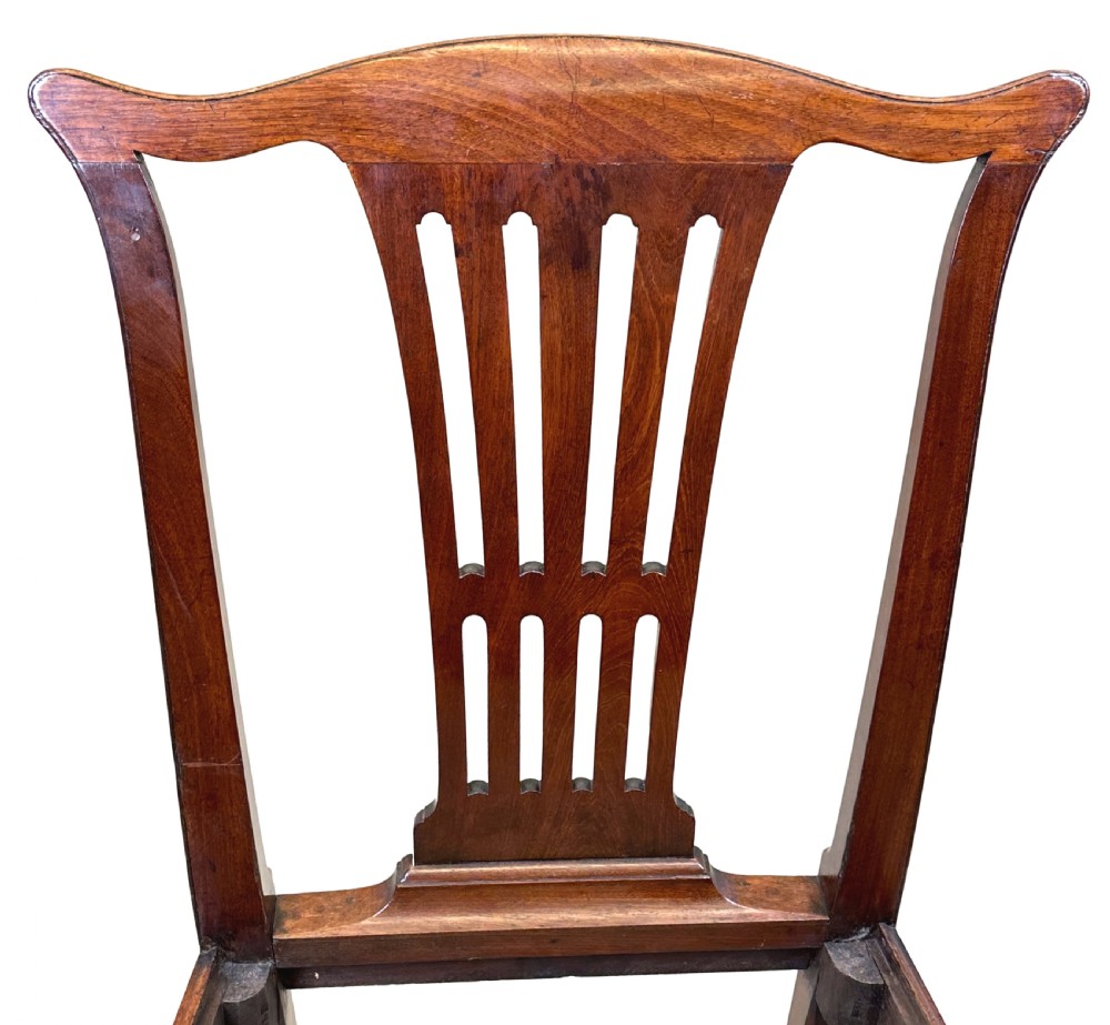 A set of six Chippendale period mahogany dining chairs with vertical slat splat backs, straight legs, and red textured upholstered seats. View VII