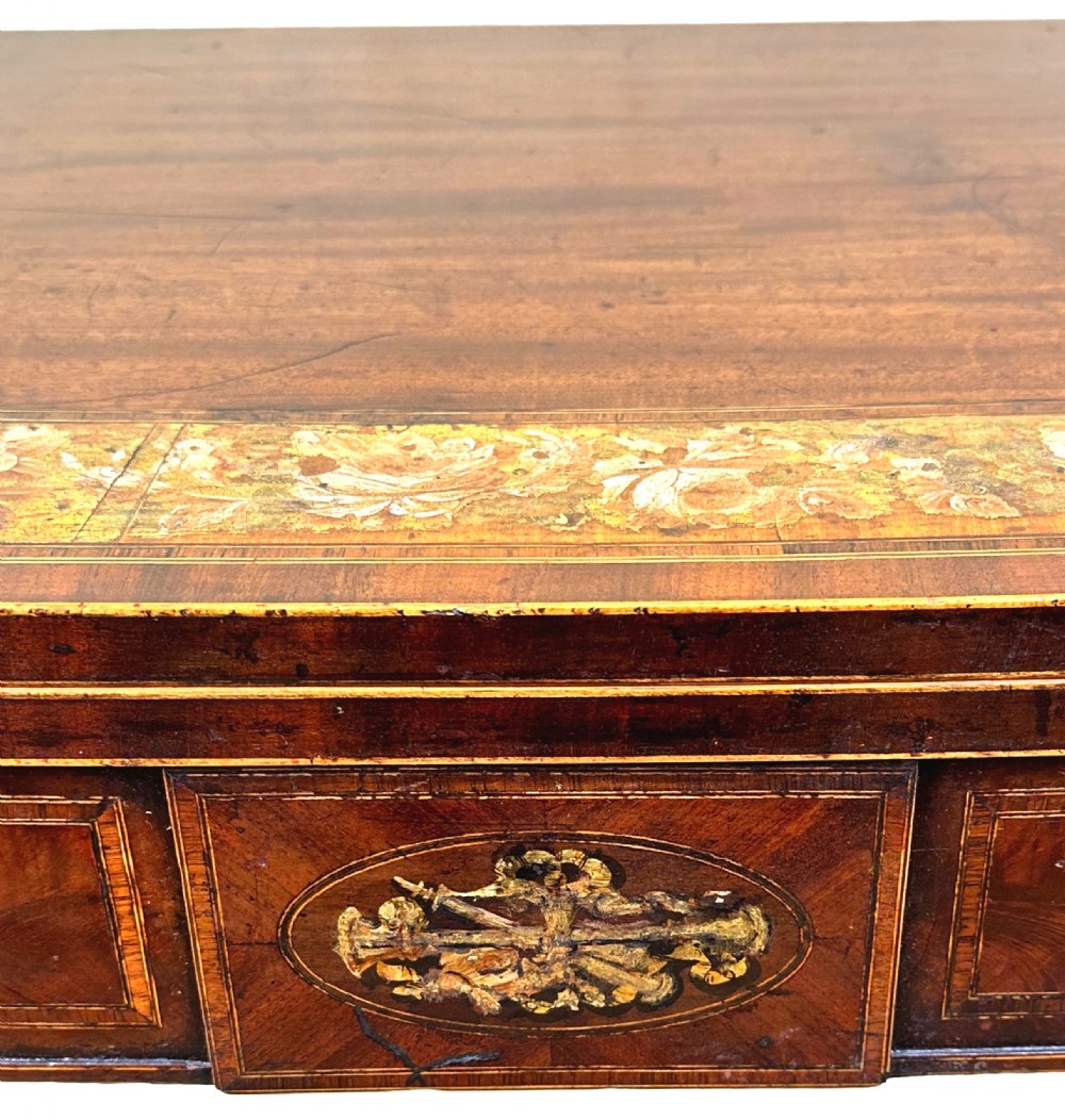 An eighteenth-century Georgian demilune mahogany tea table featuring decorative marquetry border, central brass mount, and tapered legs. View XII
