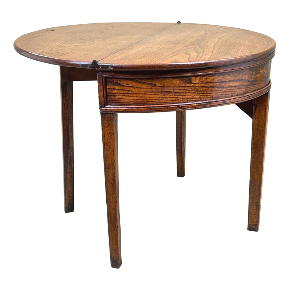 A Georgian elm demi-lune tea table displaying rich wood grain, a fold-over top, and square tapered legs. View VII
