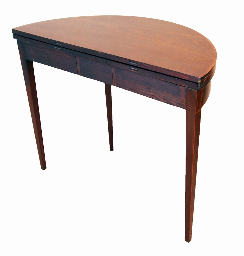 A Georgian mahogany demilune tea table featuring a semicircular fold-over top, inlaid apron, and four square tapered legs. View III
