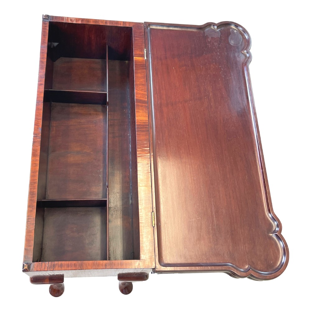 An 18th-century walnut tea table featuring a fold-over rectangular top with shaped corners, elevated on slender cabriole legs with pad feet. View VIII
