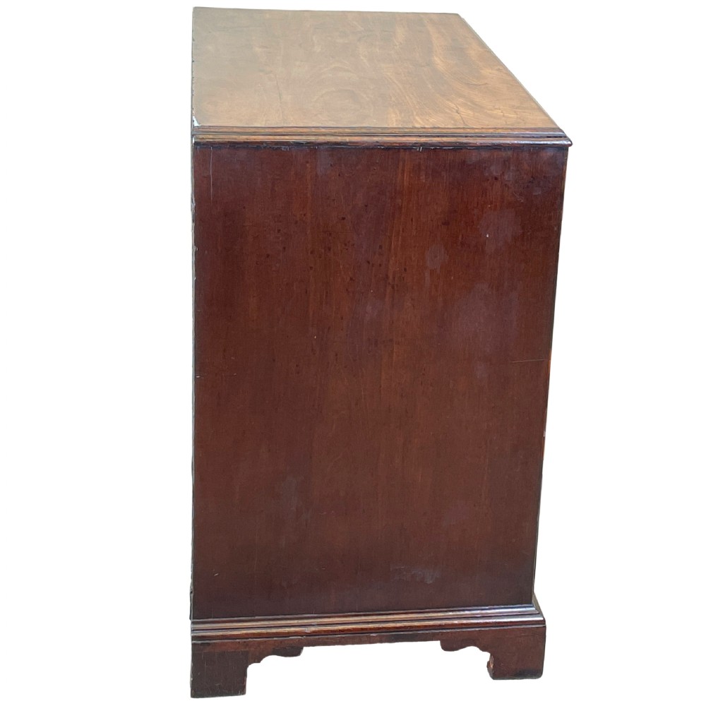 An 18th-century Georgian mahogany chest of drawers featuring four graduated drawers with brass swan-neck handles, escutcheons, and bracket feet. View VIII
