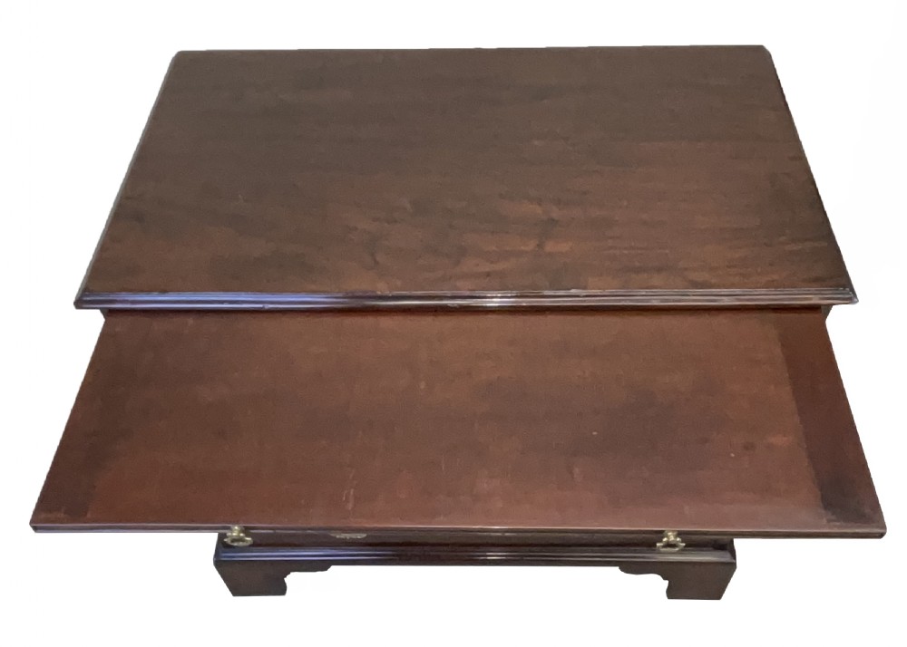An eighteenth-century Georgian mahogany chest of drawers featuring four graduated drawers, brass swan-neck handles, and bracket feet. View IX