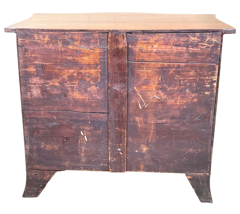A Georgian style mahogany chest of drawers featuring a serpentine front, four graduated drawers with brass ring handles, and bracket feet. View VIII