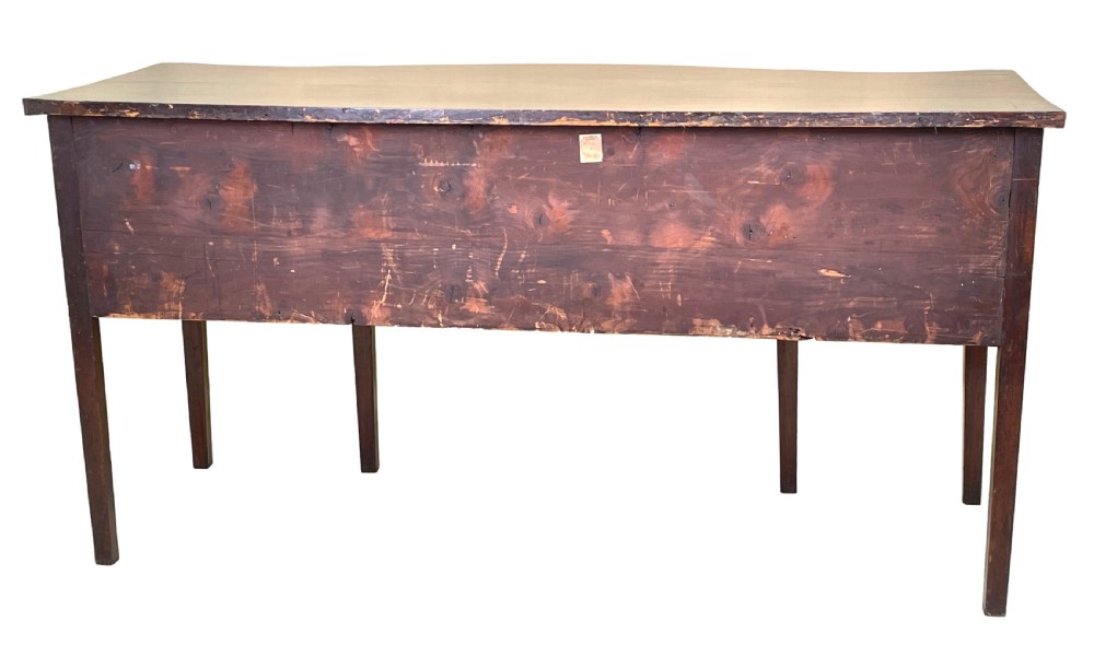 A Georgian mahogany serpentine-front sideboard featuring a polished wood top, central arched drawer, flanking drawers with brass rosette handles, and tapered square legs. View VIII