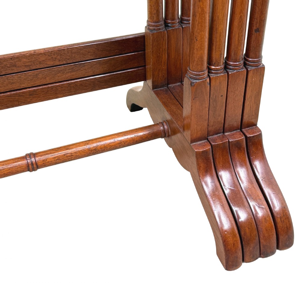 A set of four 19th century mahogany quartetto tables nested together, featuring slender turned legs and trestle feet. View XI