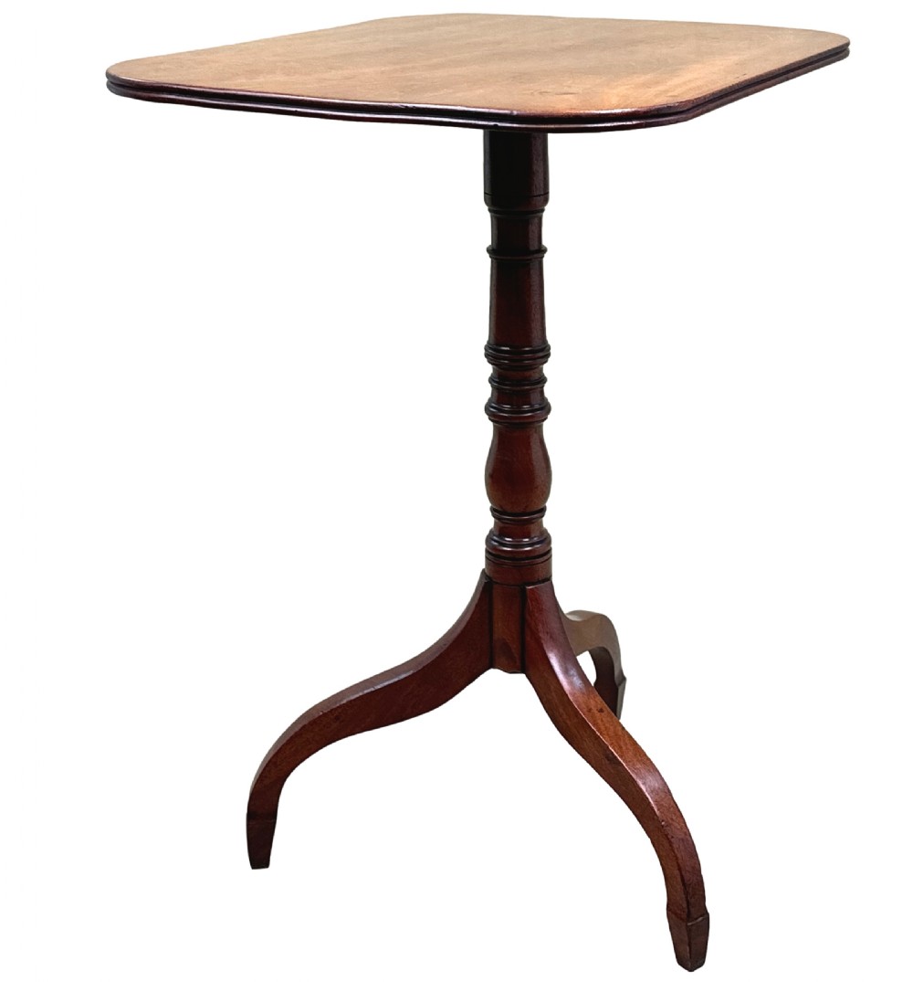 A Regency mahogany tilt-top wine table featuring a rectangular surface with rounded corners, supported by a turned central pedestal and a tripod base. View II