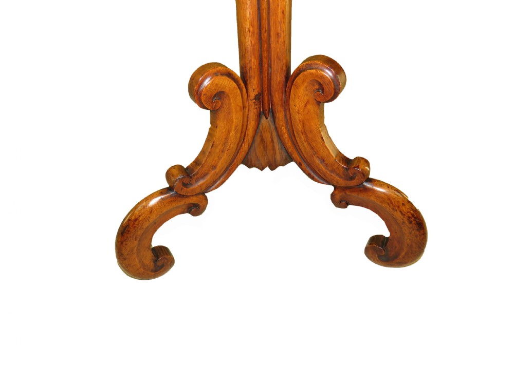 A mid-19th century hexagonal occasional table featuring geometric specimen wood marquetry on a central carved pedestal with tripod scroll legs. View III