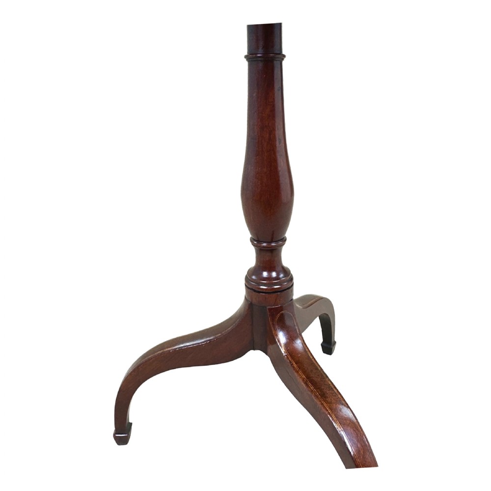 An antique Georgian circular mahogany wine table displayed with its top tilted upwards, supported by a turned pedestal column and a tripod base with three curved legs. View IX