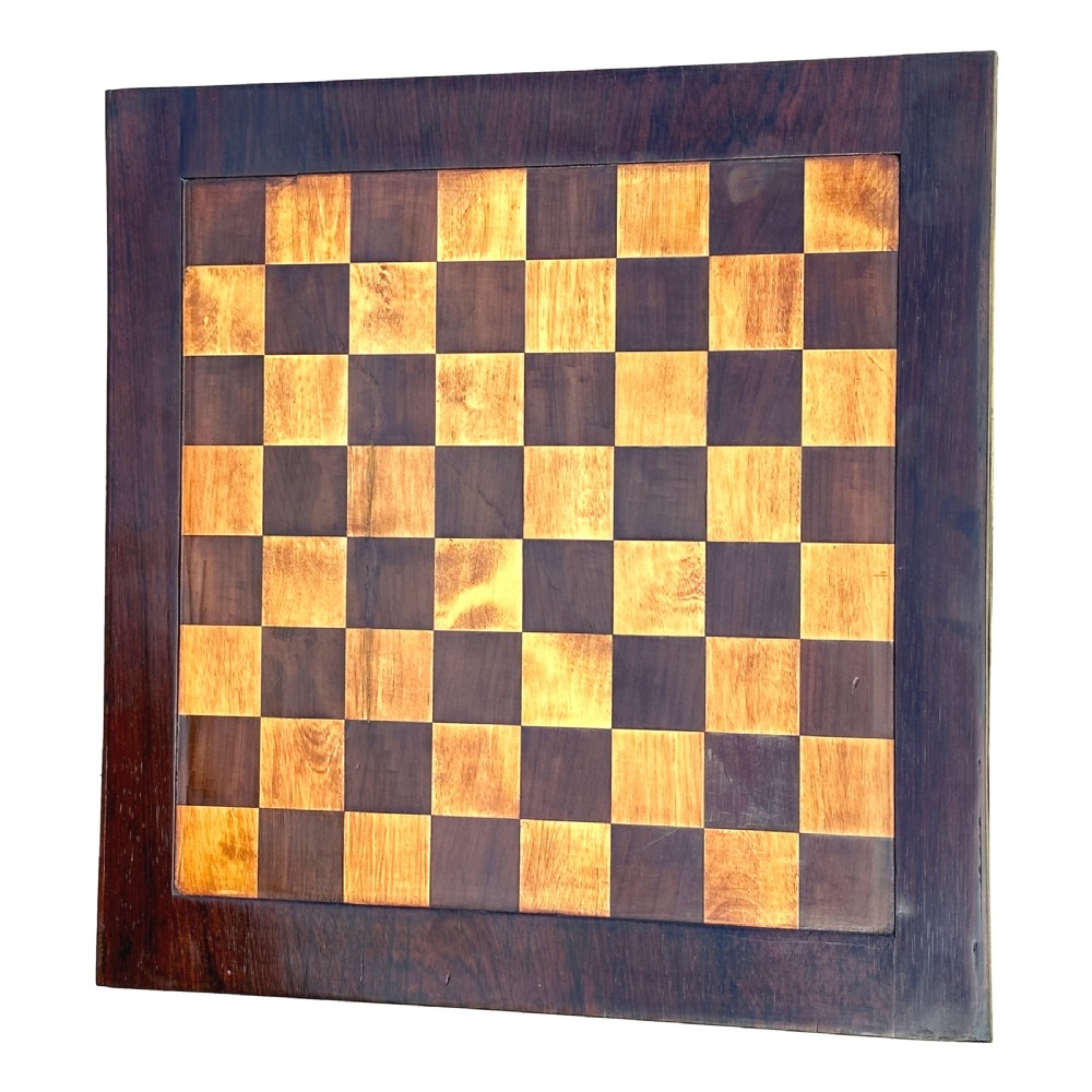 A dark rosewood Regency games table featuring slender ring-turned legs, a pierced brass gallery railing on top, and brass mounts on splayed feet. View III