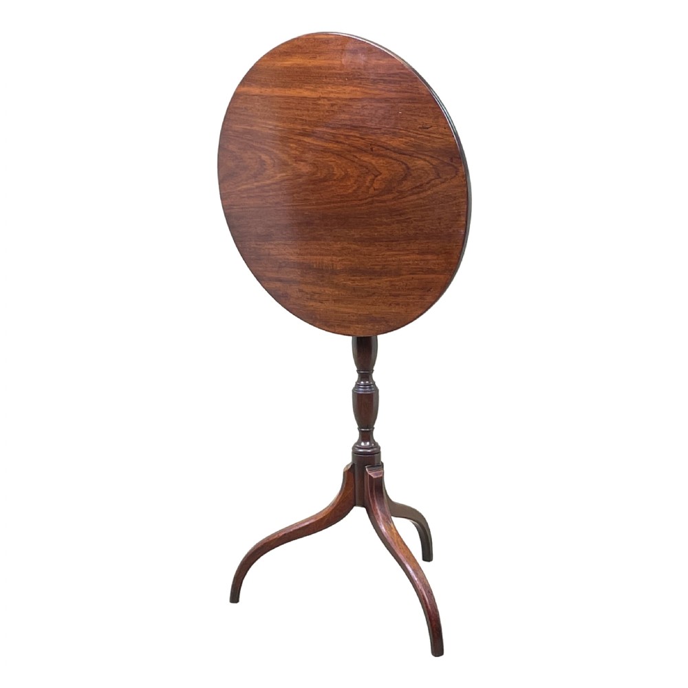 A Regency mahogany wine table featuring a flat circular top raised on a turned column and a three-legged tripod base. View II
