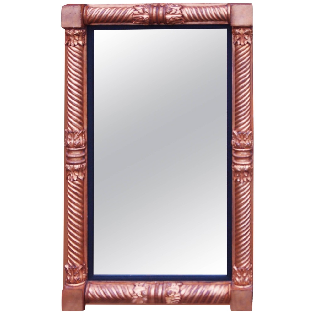 A 19th-century English Regency rectangular pier mirror featuring spiral-twist giltwood columns, carved acanthus leaf accents, and corner blocks. View II