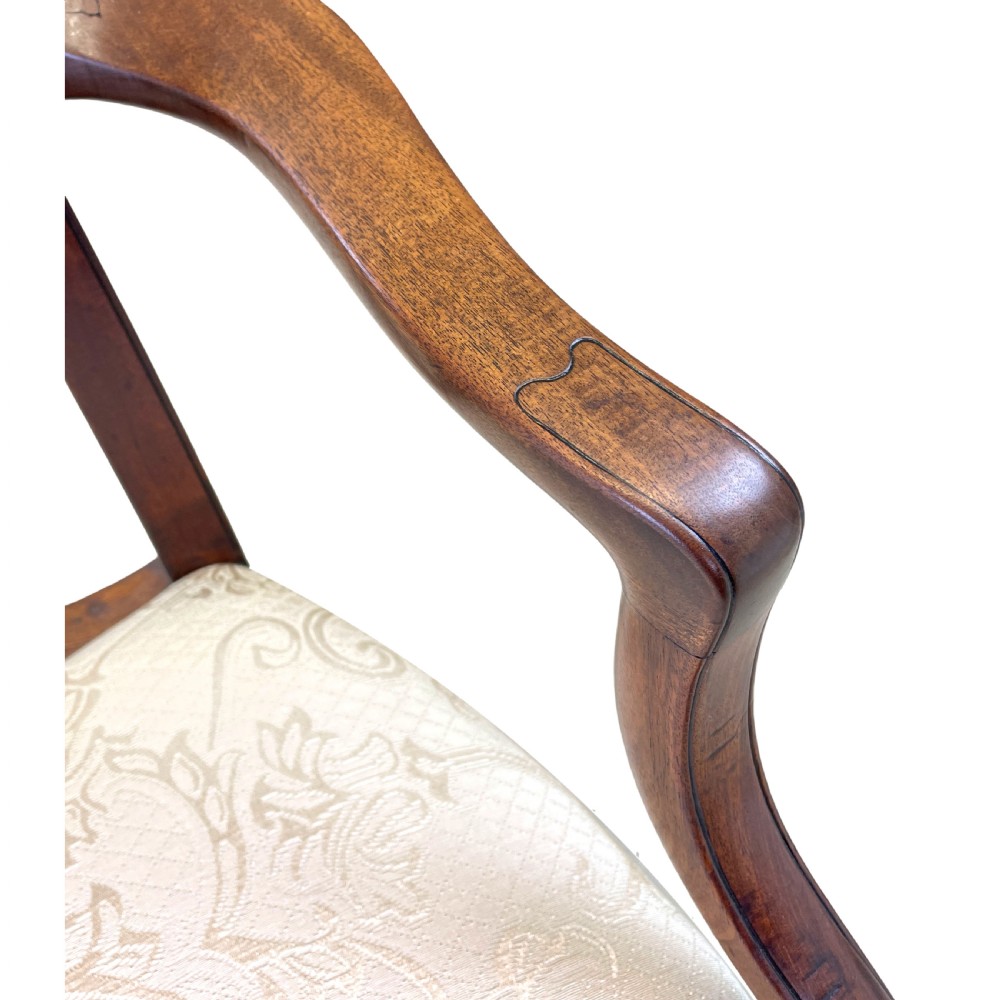 An 18th-century Georgian carved mahogany open armchair with a pierced back splat and cream patterned upholstered seat. View III