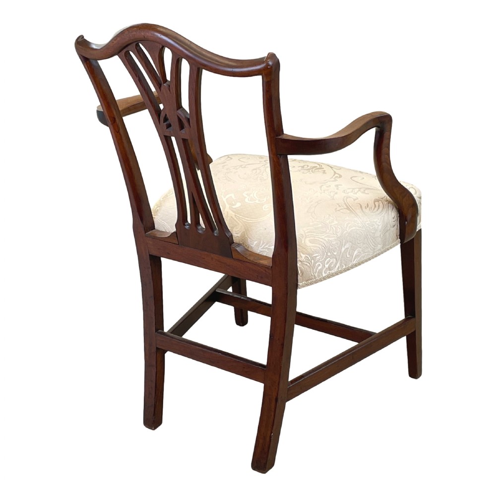 An 18th-century Georgian carved mahogany open armchair with a pierced back splat and cream patterned upholstered seat. View IV