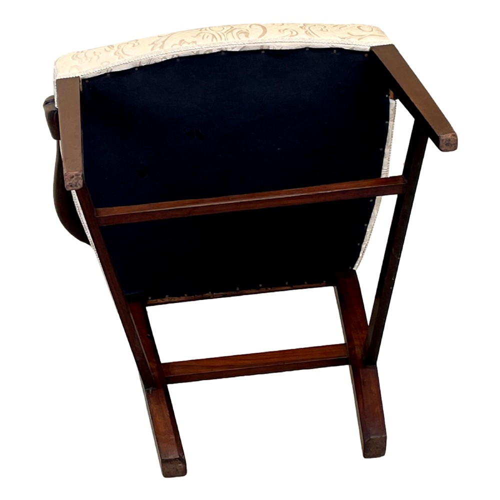 An 18th-century Georgian carved mahogany open armchair with a pierced back splat and cream patterned upholstered seat. View V