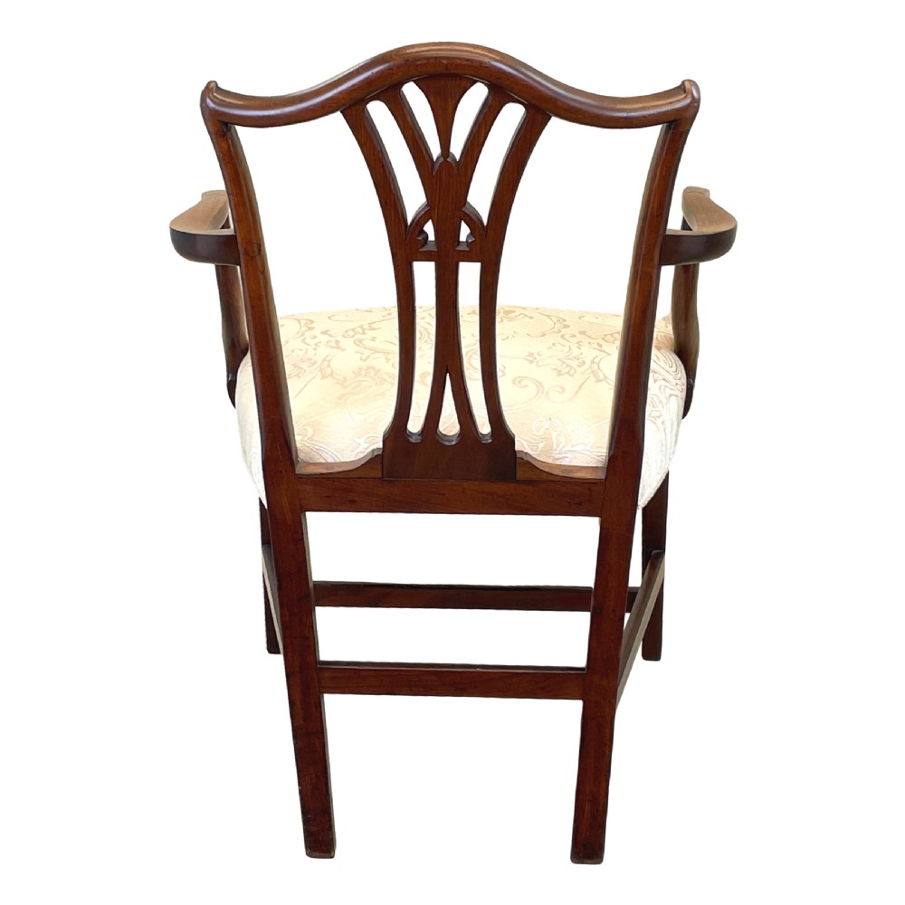 An 18th-century Georgian carved mahogany open armchair with a pierced back splat and cream patterned upholstered seat. View VIII