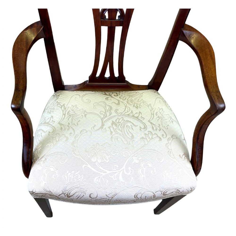 An 18th-century Georgian carved mahogany open armchair with a pierced back splat and cream patterned upholstered seat. View IX