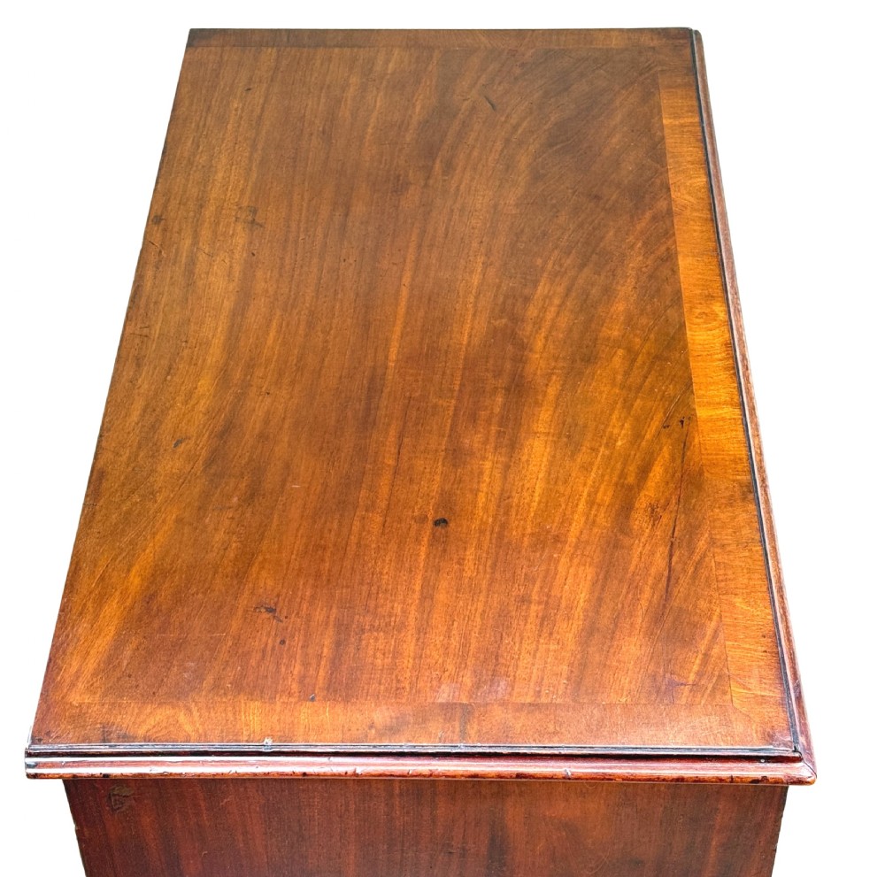 An 18th-century Chippendale mahogany chest of drawers featuring a two-over-three drawer configuration, brass swan-neck handles, keyhole escutcheons, and bracket feet. View III