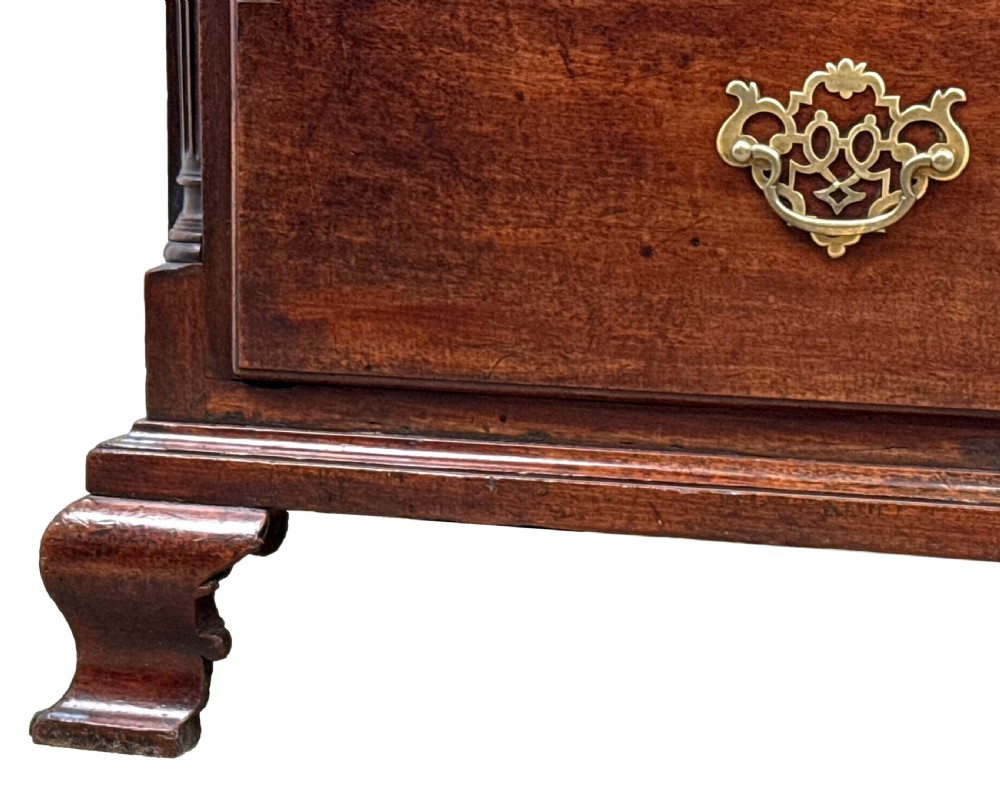 An 18th-century Chippendale mahogany tallboy chest-on-chest featuring Greek key fretwork moulding, brass handles, and bracket feet. View VI