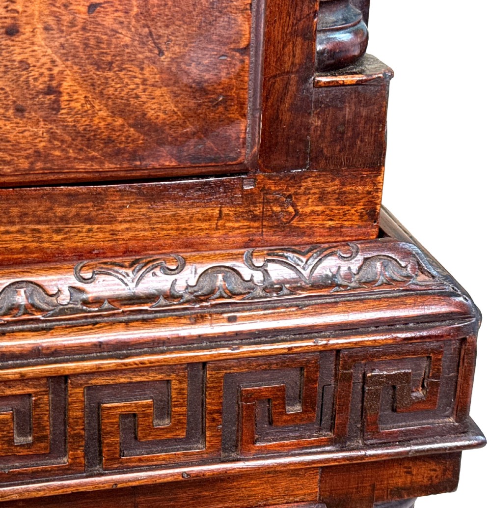 An 18th-century Chippendale mahogany tallboy chest-on-chest featuring Greek key fretwork moulding, brass handles, and bracket feet. View IX