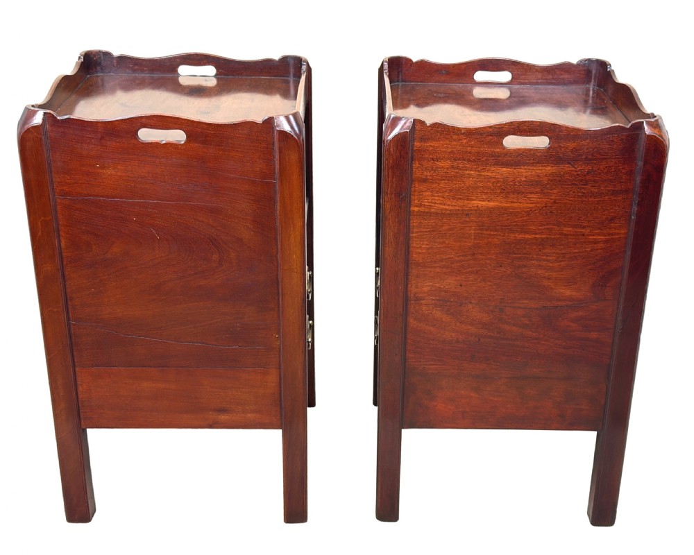 A matching pair of 18th-century mahogany bedside tables featuring gallery tops with side handles, slatted tambour doors, and drawers with brass oval handles and fine inlay. View V