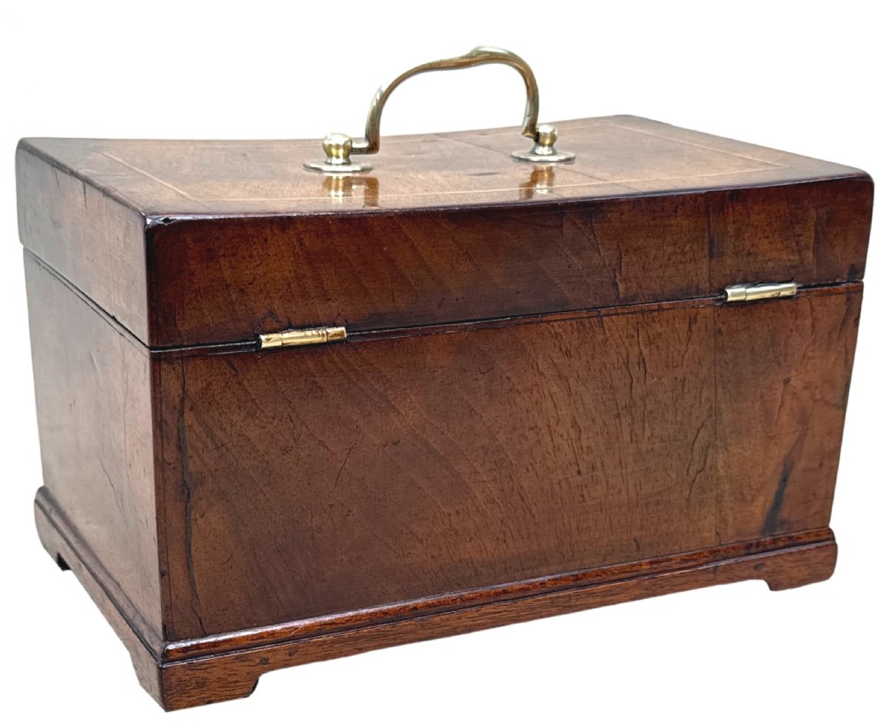 An 18th-century rectangular Georgian walnut tea caddy featuring herringbone stringing, a brass carrying handle on the lid, and a shaped brass escutcheon on the front face. View XII