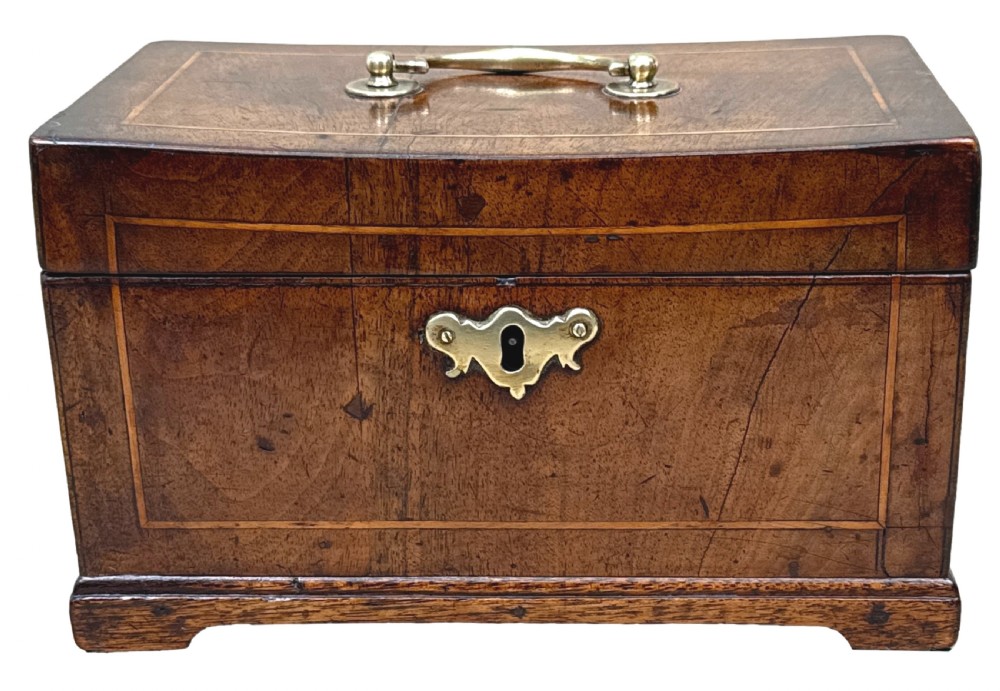 An 18th-century rectangular Georgian walnut tea caddy featuring herringbone stringing, a brass carrying handle on the lid, and a shaped brass escutcheon on the front face. View XIV