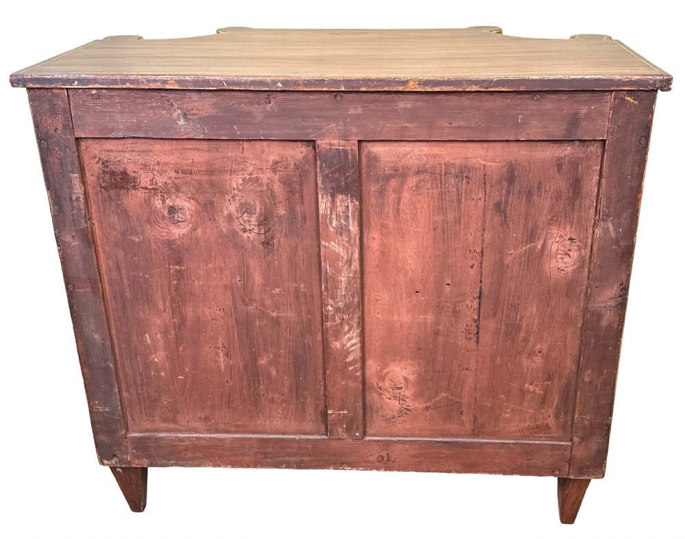 An antique Regency style breakfront side cabinet featuring simulated rosewood finishing, gold leaf gilded columns, and doors set with pleated pink fabric. View XII