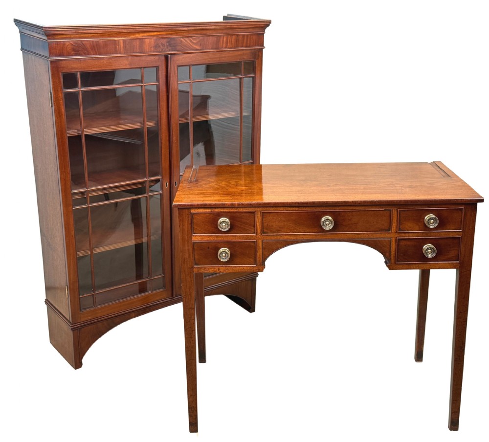 An 18th-century Georgian mahogany display cabinet featuring astragal glazed upper doors above a writing desk base with drawers and tapered legs. View VI