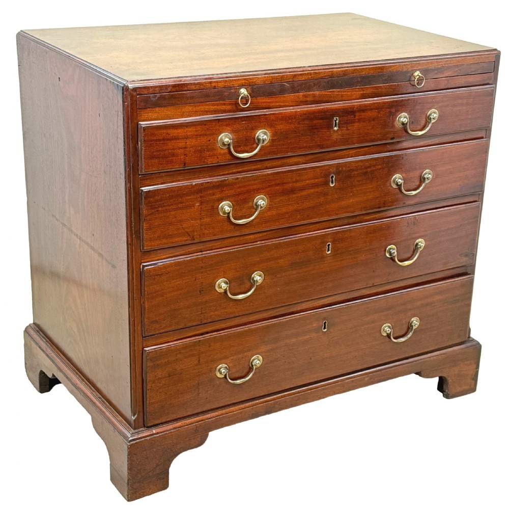 An 18th-century Georgian mahogany chest of drawers featuring four graduated drawers, brass swan-neck handles, a pull-out brushing slide, and sturdy bracket feet. View XI
