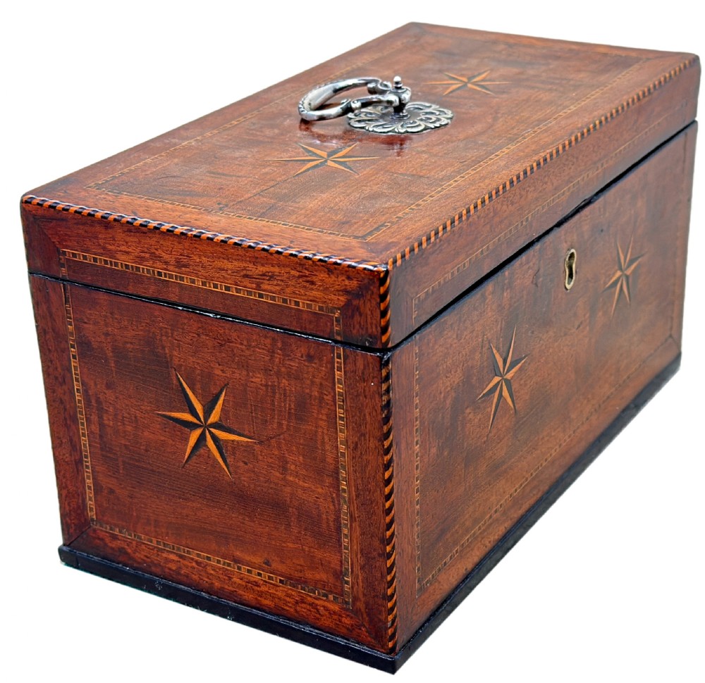 A rectangular 18th-century mahogany tea caddy featuring inlaid wooden star motifs on the front panel and a brass ring handle on top. View III