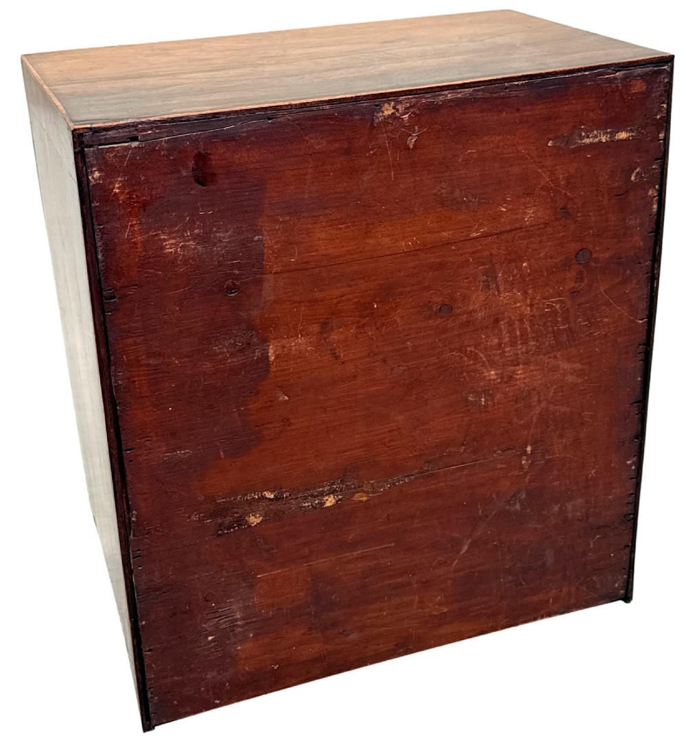 A Georgian rosewood miniature chest of four graduated drawers featuring stringing inlay and small round knob pulls. View IX