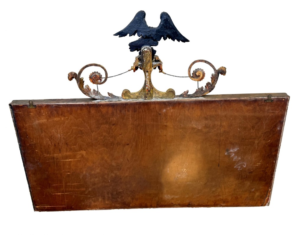 A Regency giltwood tripartite overmantel mirror featuring ball moulding details, ebonised inner slips, and an ebonised eagle crest surmount. View XII
