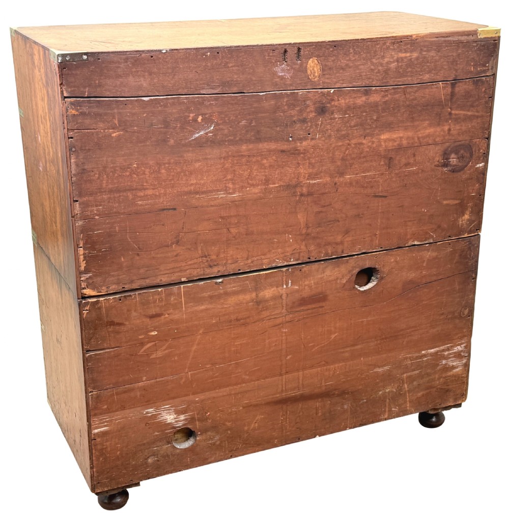 A nineteenth-century camphor wood military campaign chest of drawers featuring flush brass handles, corner brackets, and turned bun feet. View XI