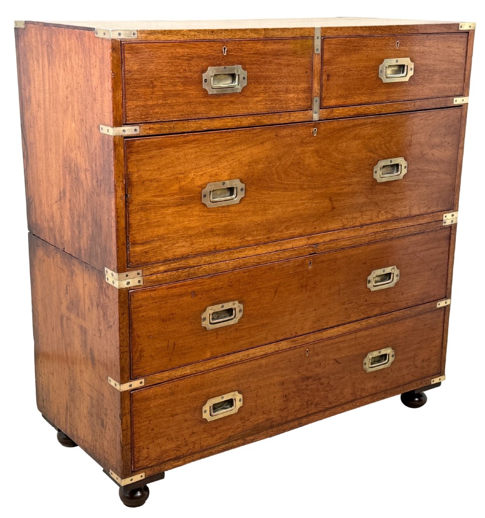 A nineteenth-century camphor wood military campaign chest of drawers featuring flush brass handles, corner brackets, and turned bun feet. View XIV