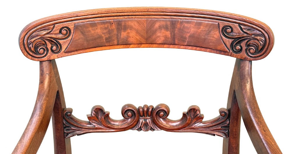 A pair of Regency mahogany carver armchairs featuring scrolled arms, carved back rails, and red plaid upholstered drop-in seats. View III