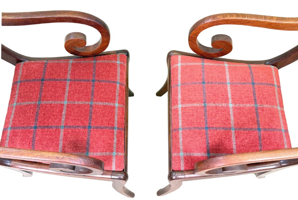 A pair of Regency mahogany carver armchairs featuring scrolled arms, carved back rails, and red plaid upholstered drop-in seats. View VI