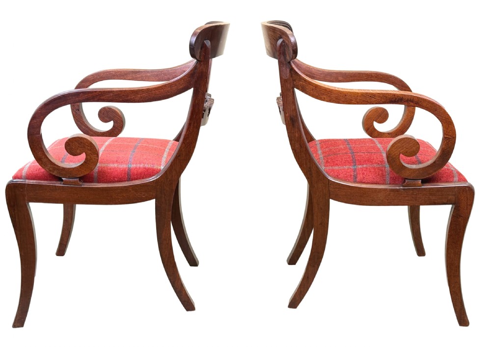 A pair of Regency mahogany carver armchairs featuring scrolled arms, carved back rails, and red plaid upholstered drop-in seats. View IX