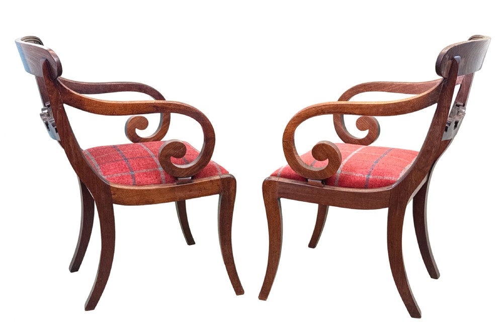 A pair of Regency mahogany carver armchairs featuring scrolled arms, carved back rails, and red plaid upholstered drop-in seats. View XI