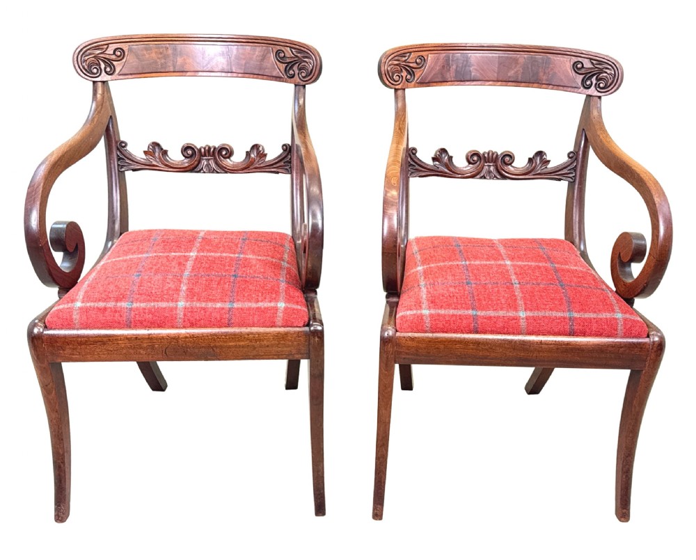 A pair of Regency mahogany carver armchairs featuring scrolled arms, carved back rails, and red plaid upholstered drop-in seats. View XV
