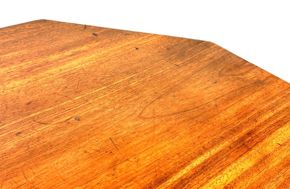 A Georgian mahogany wine table with an octagonal top, turned pedestal stem, and tripod cabriole legs. View III