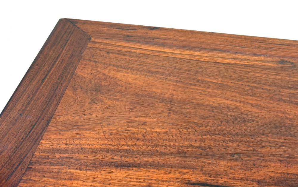 A 19th-century Chinese hardwood coffee table with a rectangular inset top, openwork carved bamboo apron, and low legs. View III