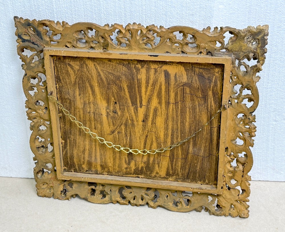 A 19th-century rectangular Italian Florentine mirror framed with deeply carved openwork gilded foliage and acanthus leaf details. View VIII